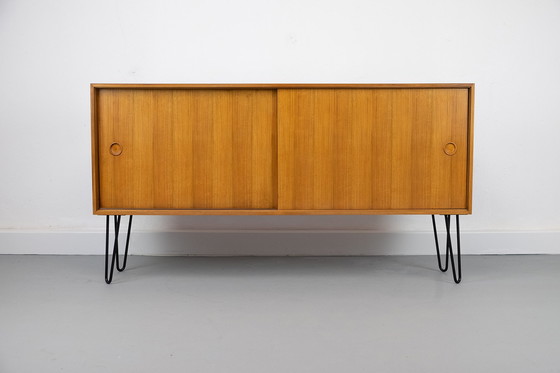 Image 1 of Vintage notenhouten Dressoirs met schuifdeuren, jaren 60