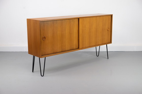 Image 1 of Vintage notenhouten Dressoirs met schuifdeuren, jaren 60