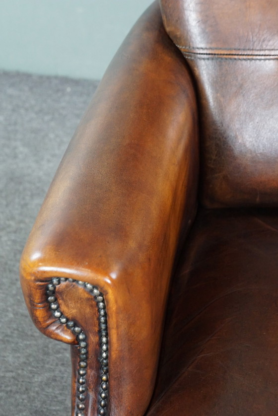 Image 1 of Armchair van schapenleer met hoge rug en in goede staat