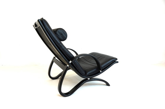 Image 1 of Nelo Zweden lederen fauteuil met poef