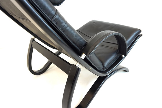 Image 1 of Nelo Zweden lederen fauteuil met poef