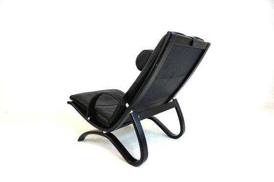 Image 1 of Nelo Zweden lederen fauteuil met poef