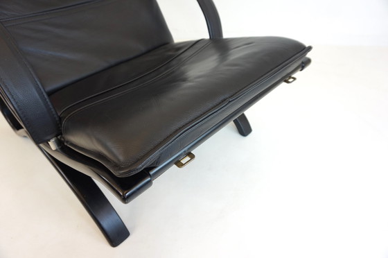Image 1 of Nelo Zweden lederen fauteuil met poef