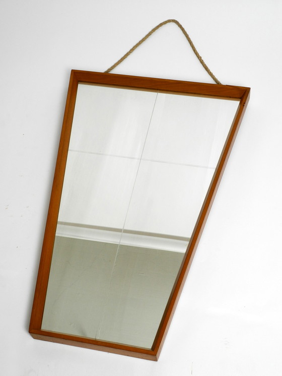 Image 1 of Mooie grote Mid Century wandspiegel in trapeziumvorm met een massief kersenhouten frame