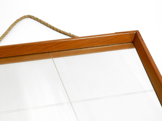 Image 1 of Mooie grote Mid Century wandspiegel in trapeziumvorm met een massief kersenhouten frame