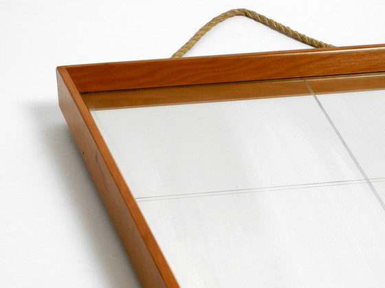 Image 1 of Mooie grote Mid Century wandspiegel in trapeziumvorm met een massief kersenhouten frame