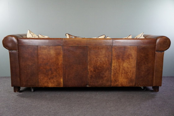 Image 1 of Ruime schapenleren 3 zits-bank met stoffen kussens