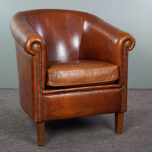 Schapenleren clubfauteuil met een cognac kleur