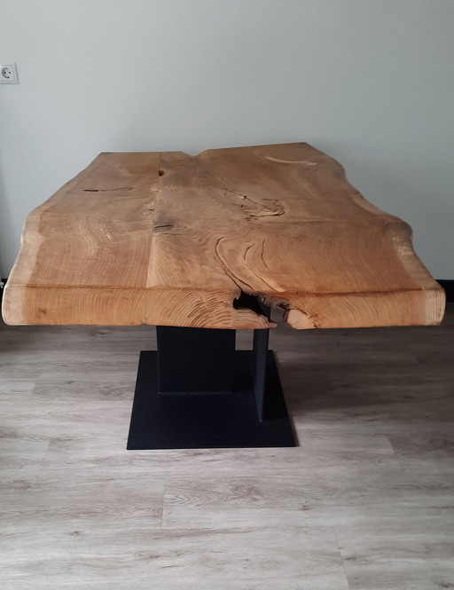 Robust solid oak tree trunk table.