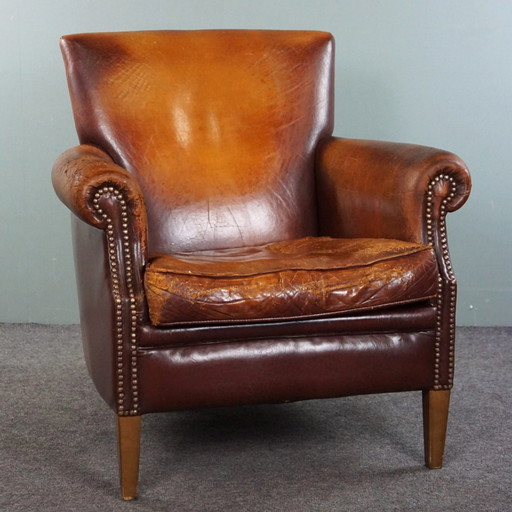 Sheep leather armchair with a worn look