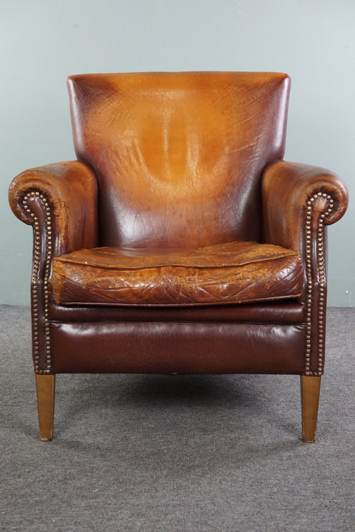 Sheep leather armchair with a worn look