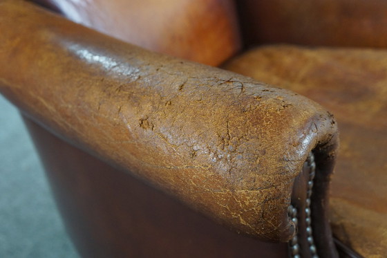 Image 1 of Sheep leather armchair with a worn look