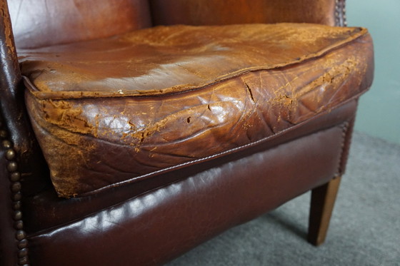 Image 1 of Sheep leather armchair with a worn look