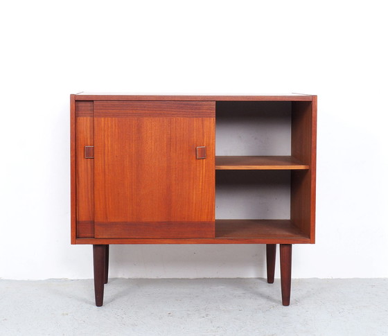 Image 1 of Small teak dresser with sliding doors