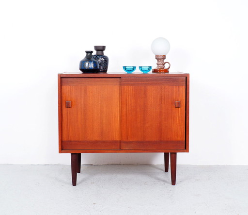 Small teak dresser with sliding doors