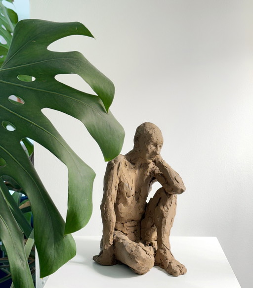 Yolande Ide - a terracotta sculpture of a naked man