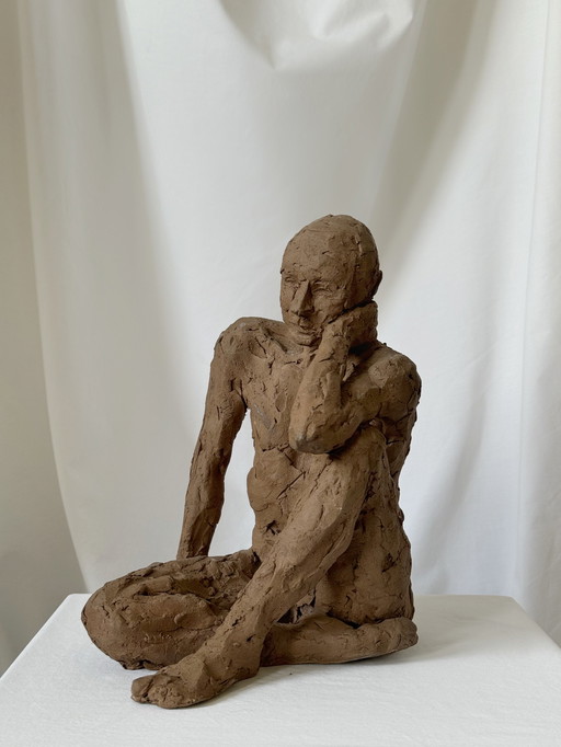 Yolande Ide - a terracotta sculpture of a naked man