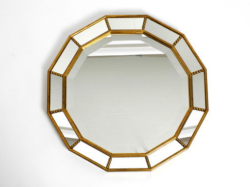 Beautiful Italian 12 sided gold-plated wall mirror with facet cut from the 1960s