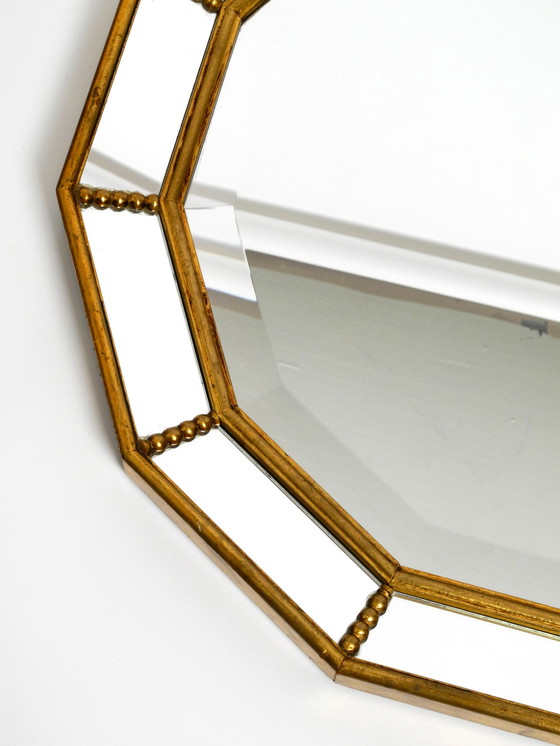 Image 1 of Beautiful Italian 12 sided gold-plated wall mirror with facet cut from the 1960s