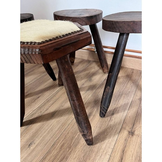 Image 1 of Set of 4 vintage tripod stools covered in cowhide