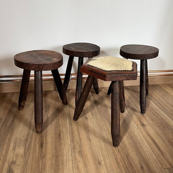 Image 1 of Set of 4 vintage tripod stools covered in cowhide