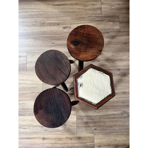 Image 1 of Set of 4 vintage tripod stools covered in cowhide