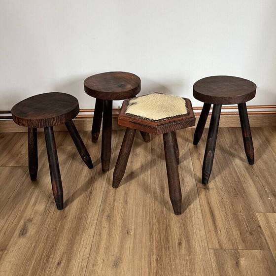 Image 1 of Set of 4 vintage tripod stools covered in cowhide