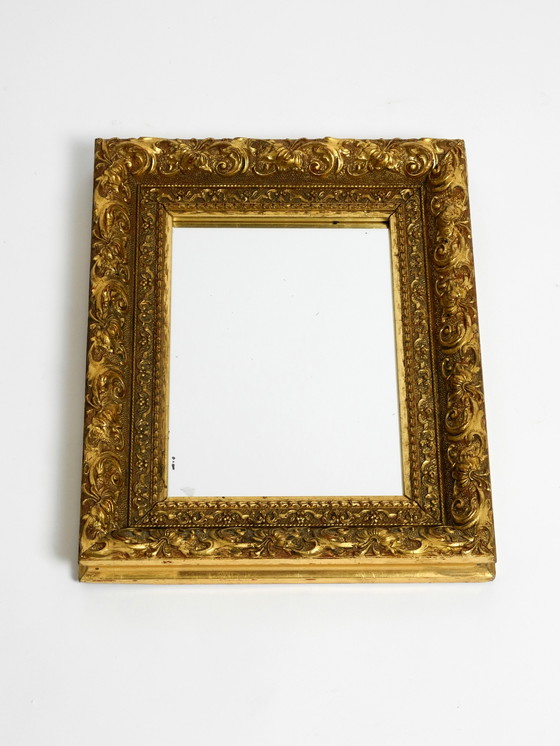 Image 1 of Mid Century wall mirror from Italy with an ornate, gold-plated wooden frame