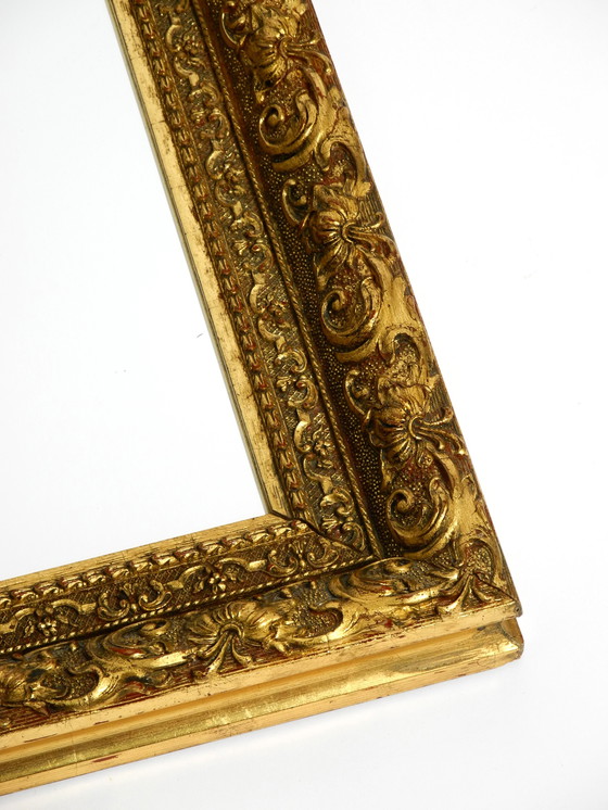 Image 1 of Mid Century wall mirror from Italy with an ornate, gold-plated wooden frame