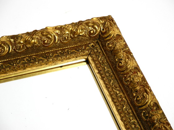 Image 1 of Mid Century wall mirror from Italy with an ornate, gold-plated wooden frame