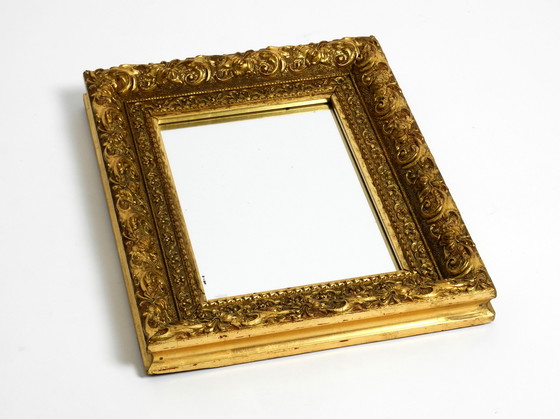 Image 1 of Mid Century wall mirror from Italy with an ornate, gold-plated wooden frame