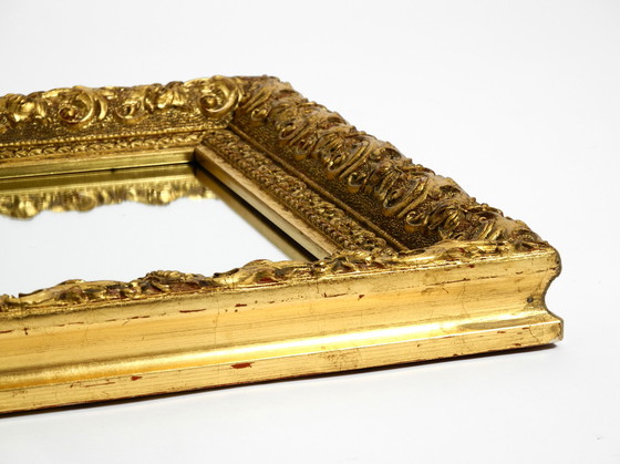 Image 1 of Mid Century wall mirror from Italy with an ornate, gold-plated wooden frame