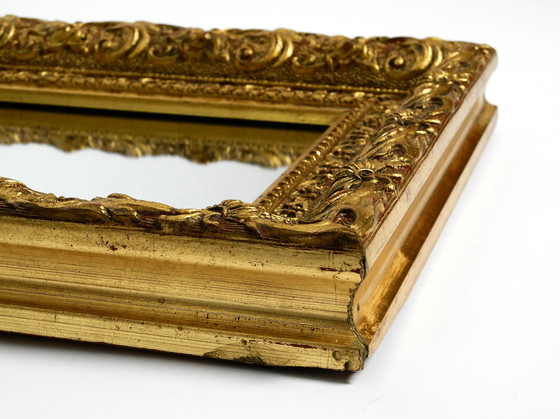 Image 1 of Mid Century wall mirror from Italy with an ornate, gold-plated wooden frame