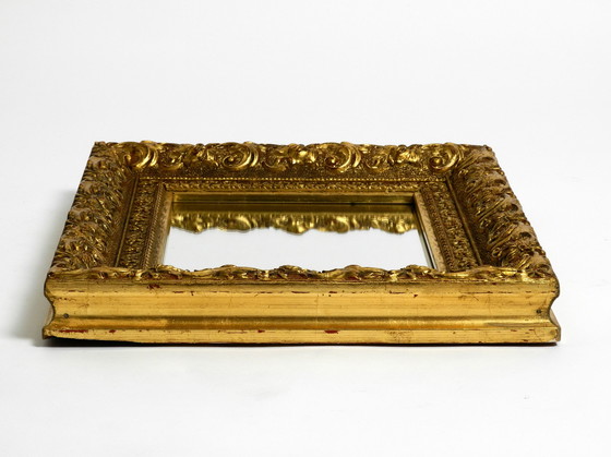 Image 1 of Mid Century wall mirror from Italy with an ornate, gold-plated wooden frame