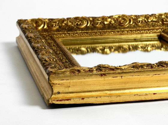 Image 1 of Mid Century wall mirror from Italy with an ornate, gold-plated wooden frame