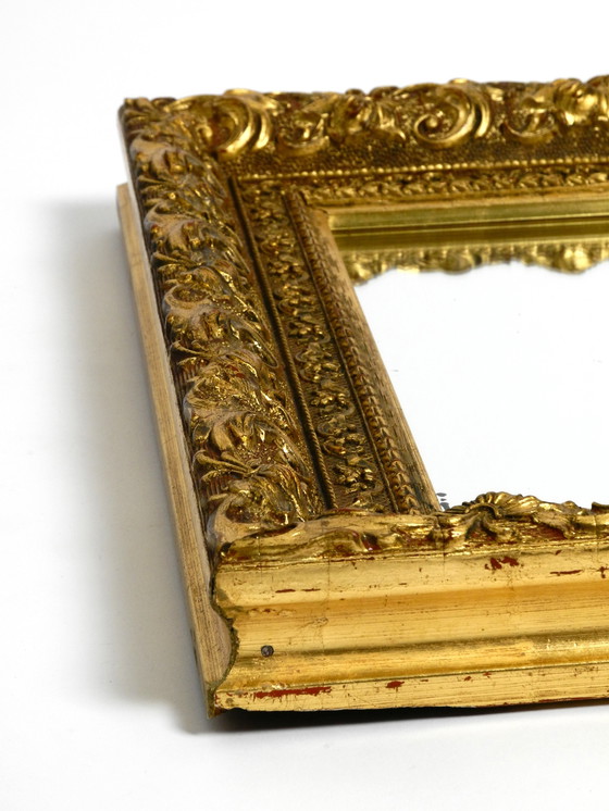 Image 1 of Mid Century wall mirror from Italy with an ornate, gold-plated wooden frame