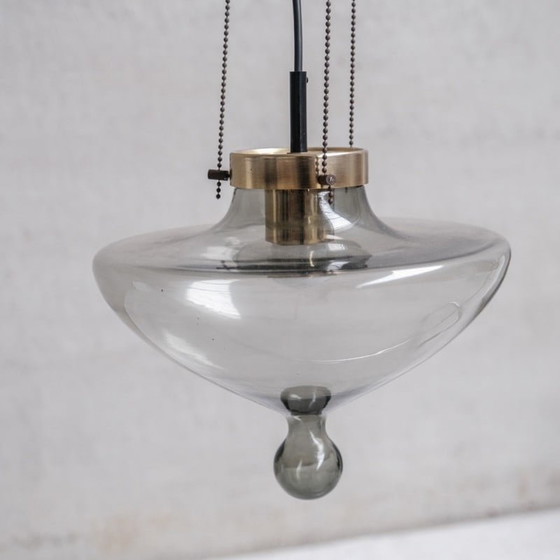 Image 1 of Pair of vintage pendant lamp in smoked glass and brass for Raak, Netherlands 1970