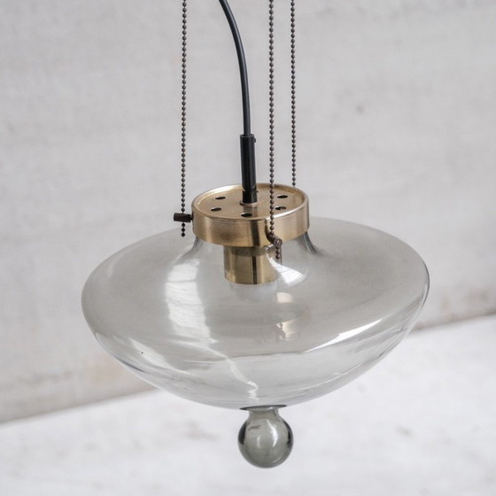 Image 1 of Pair of vintage pendant lamp in smoked glass and brass for Raak, Netherlands 1970