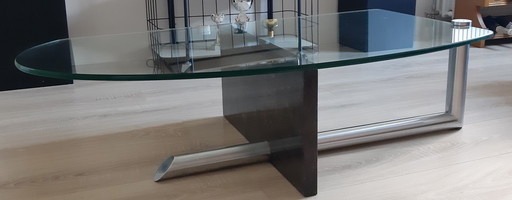 Glass coffee table with granite upright