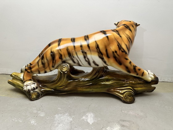 Image 1 of Prowling tiger on tree trunk ceramic