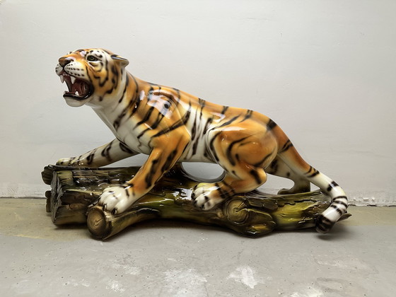 Image 1 of Prowling tiger on tree trunk ceramic