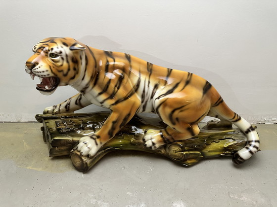 Image 1 of Prowling tiger on tree trunk ceramic