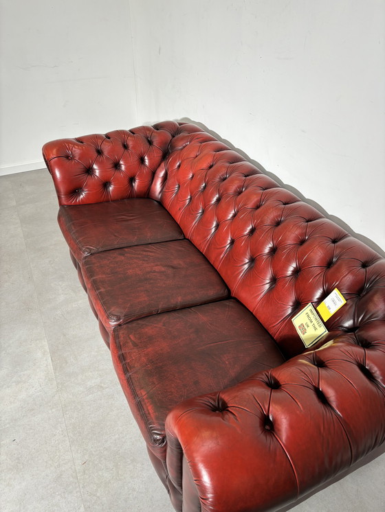 Image 1 of Chesterfield red leather sofa