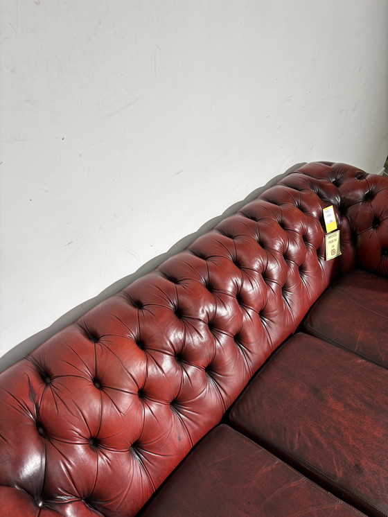 Image 1 of Chesterfield red leather sofa