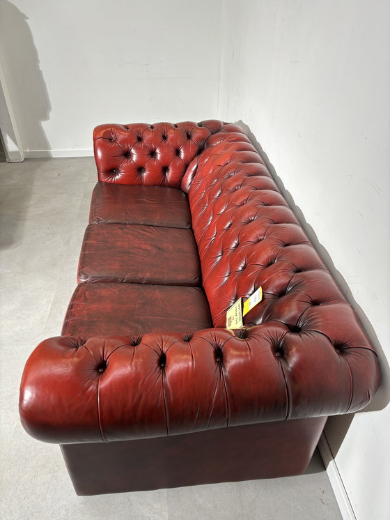 Image 1 of Chesterfield red leather sofa