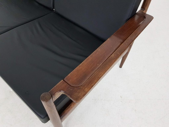 Image 1 of Rosewood sofa with black vinyl upholstery