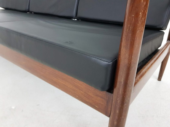 Image 1 of Rosewood sofa with black vinyl upholstery