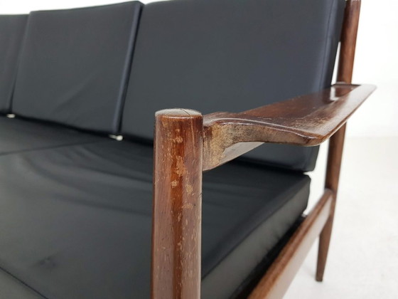 Image 1 of Rosewood sofa with black vinyl upholstery