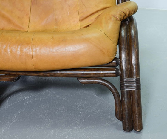 Image 1 of Brutalist Bentwood Loveseat Bamboo Sofa and Lounge Chair with Caramel Leather Upholstery, 1960s. 