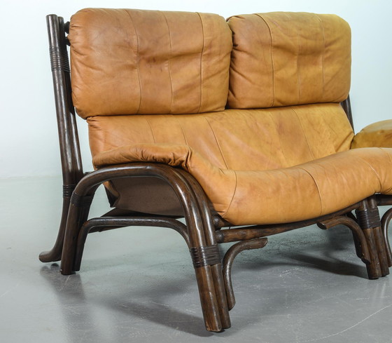 Image 1 of Brutalist Bentwood Loveseat Bamboo Sofa and Lounge Chair with Caramel Leather Upholstery, 1960s. 